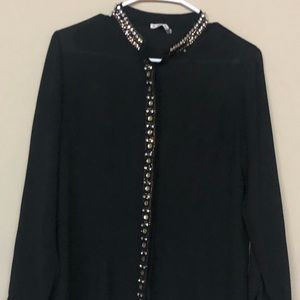 A bedazzled long sleeved black shirt